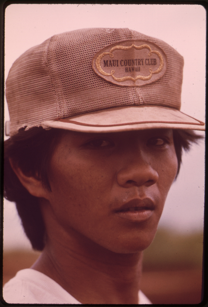 Young sugarcane field worker. His hat symbolizes effects of tourism and affluence