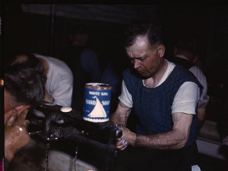 Joseph Klesken washing up after a day's work at the rip tracks at Proviso yards of the C & NW RR., Chicago, Ill., 194