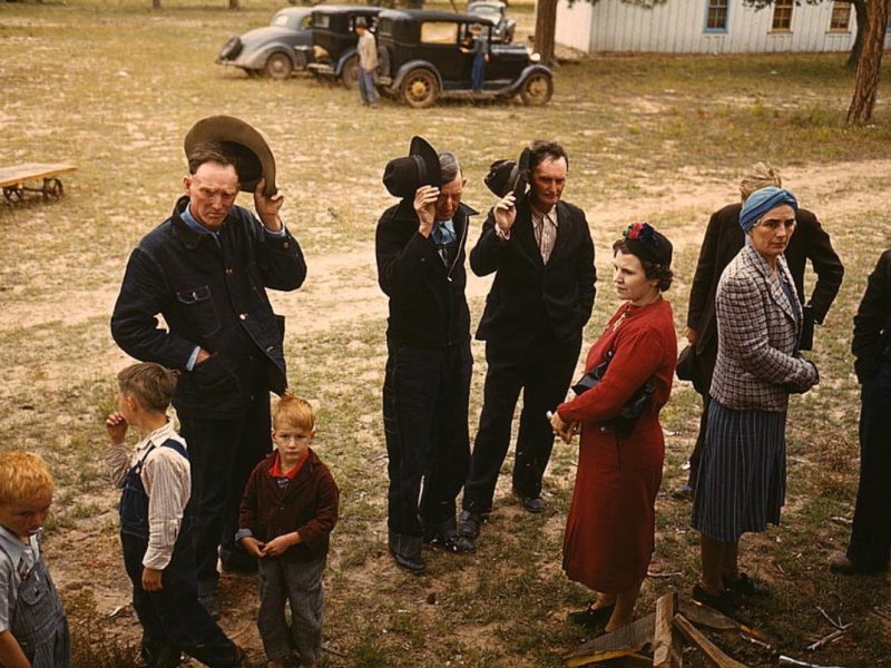 Saying grace before the barbecue dinner at the Pie Town, New Mexico Fair, 1940