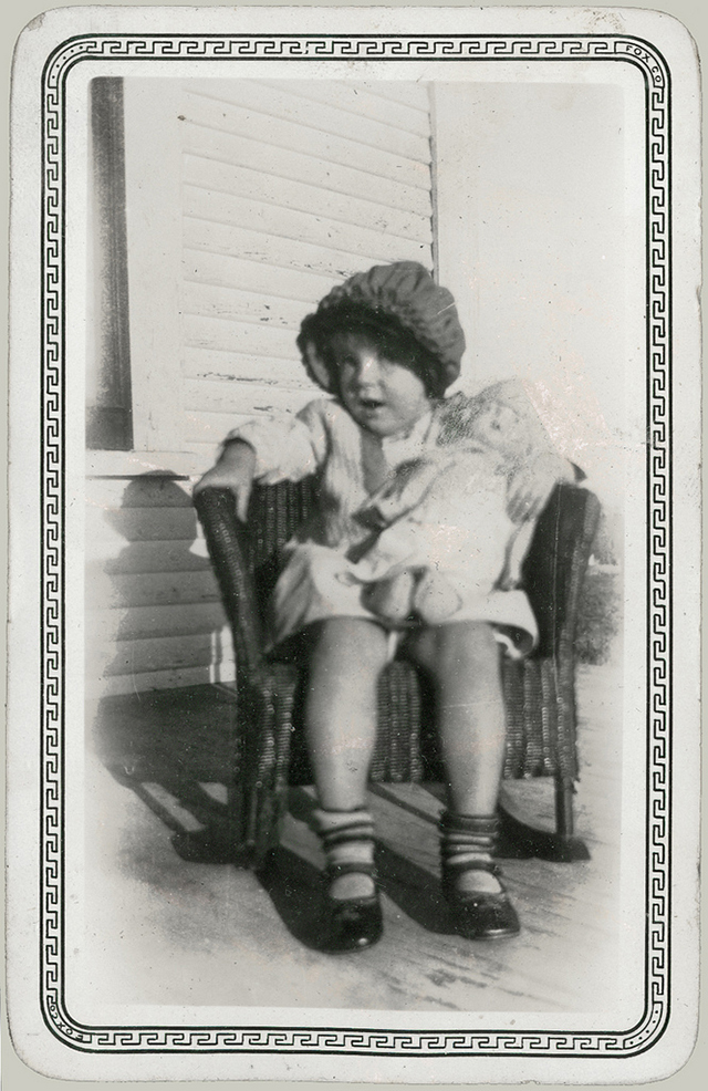 Child in Rocker with Doll