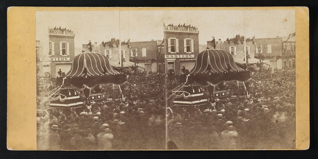 Abraham Lincoln's casket conveyed by funeral car through the crowd on Broad Street in Philadelphia, April 22, 1865.