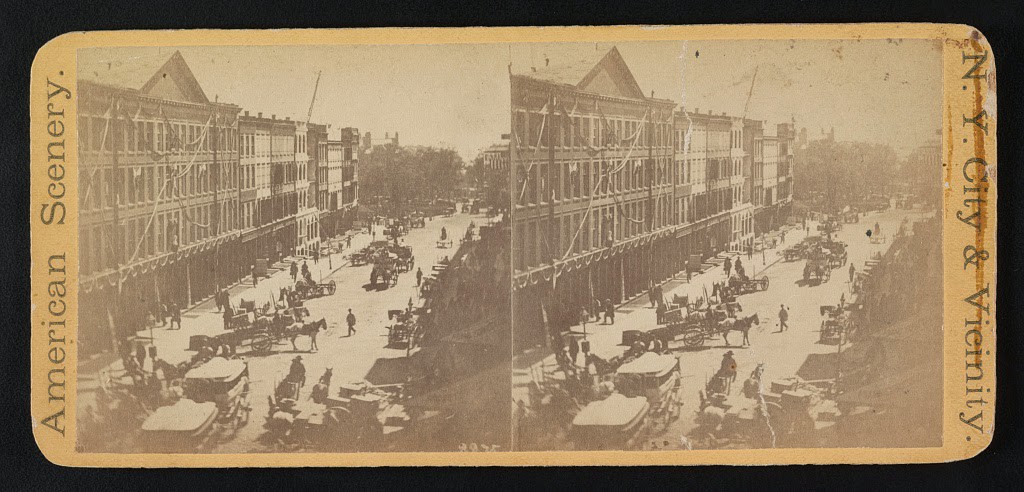 An aerial view of buildings on Broadway near Bowling Green draped with mourning cloth in preparation for Abraham Lincoln's funeral procession, April 24, 1865.