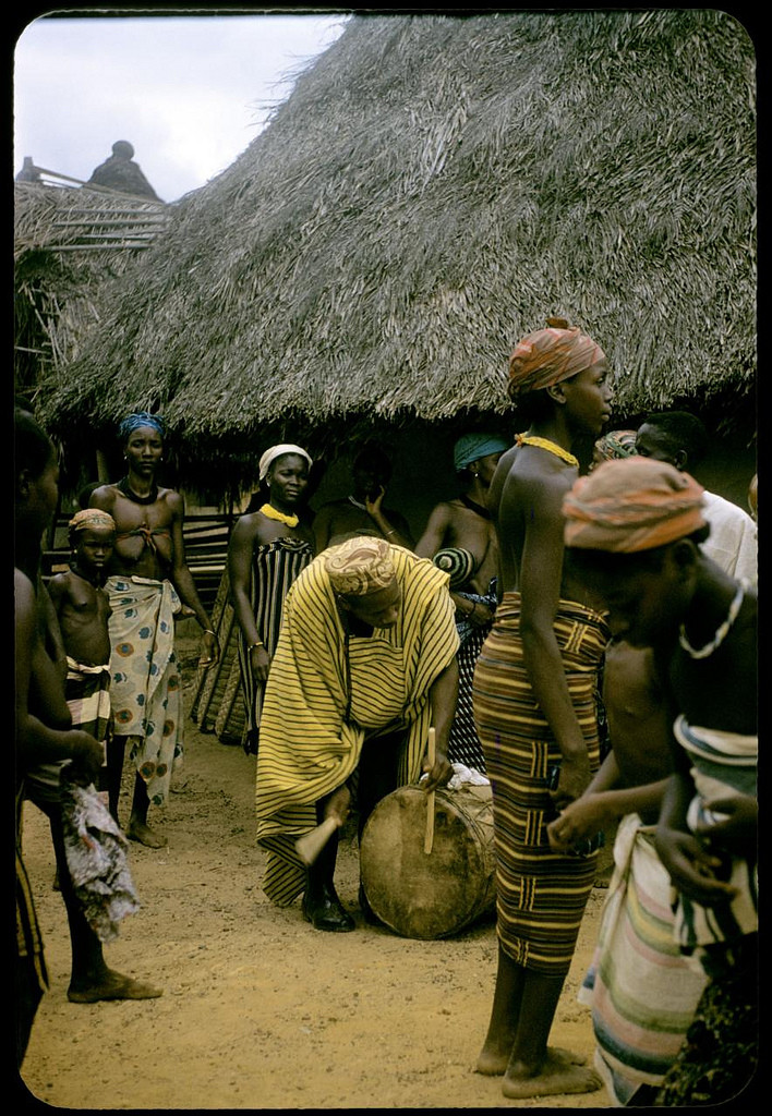 Wozi town chief drumming at the end of bush school, Wozi, Liberia, 1958. William Gotwald Liberia mission slides, 1957-1960. ELCA Archives scan. http://www.elca.org/archives