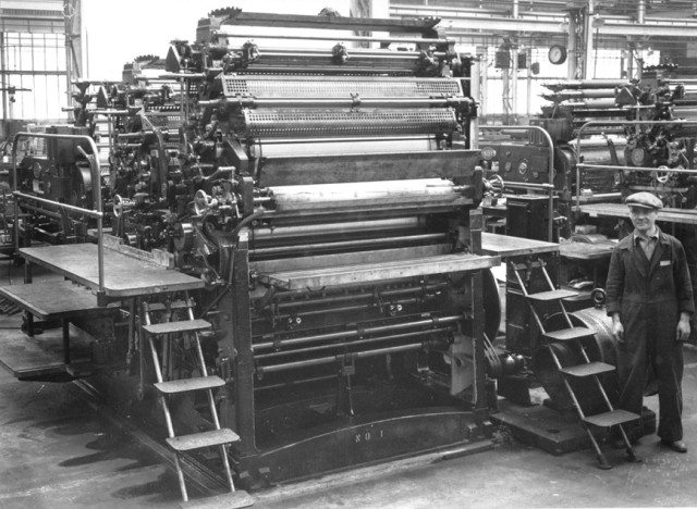 View of a printing press in 11 Shop.