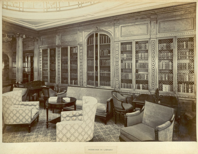 Bookcase in library. Situated on the boat deck, along with a lounge, music room and smoking room, the library was one of many first-class facilities on board the ship