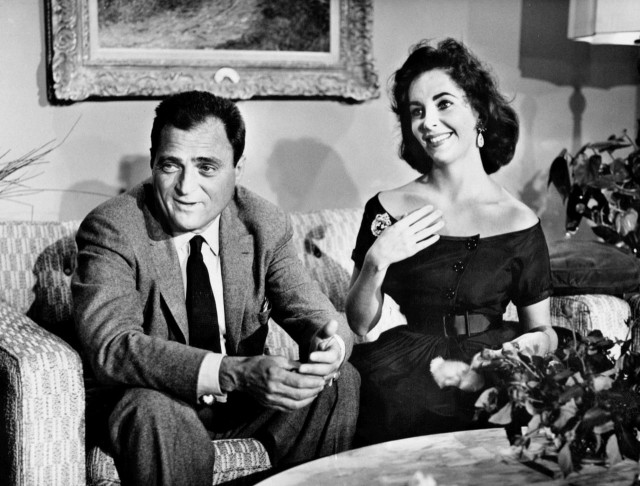 Taylor with third husband Mike Todd in an interview for Person to Person in 1957.Source