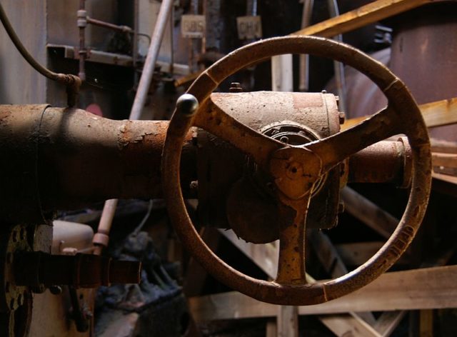 Hand-operated valve near the hot stoves. The plant was last overhauled in the 1930s, and is operated almost entirely by hand. It is believed to be the only remaining example of pre-WWII blast furnace technology.
