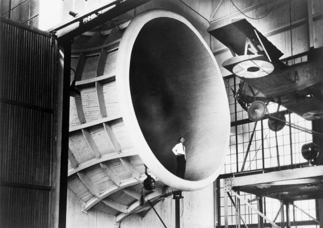 A Langley researcher observes a Sperry M-1 Messenger, the first full-scale airplane tested in the Propeller Research Tunnel.