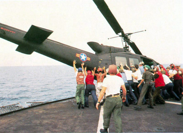 RVNAF-Huey-is-pushed-overboard-from-USS-Midway.source