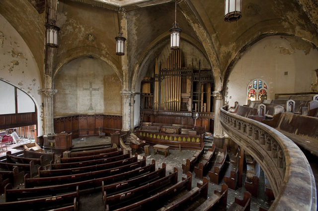 The main sanctuary of the Woodward Avenue Presbyterian Church, view from east balcony, highlighting the curved pews and pipe organ.