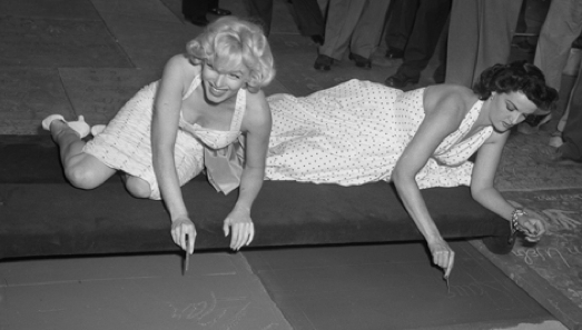 With Marilyn Monroe in 1953..Source