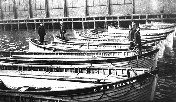 Titanic's wooden lifeboats in New York Harbor following the disaster. This particular image has been doctored to add the words "R.M.S. Titanic". In fact the lifeboats bore the name "S.S. Titanic"on a plaque mounted at the other end of the boat. source