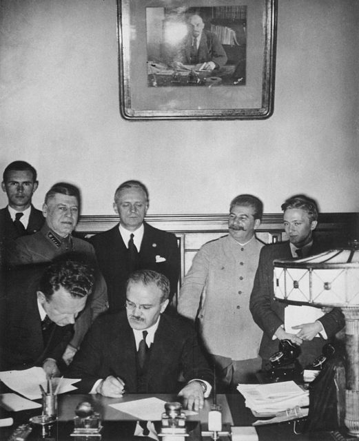 Soviet Premier and Foreign Commissar Vyacheslav Molotov signs the German–Soviet non-aggression pact. Source