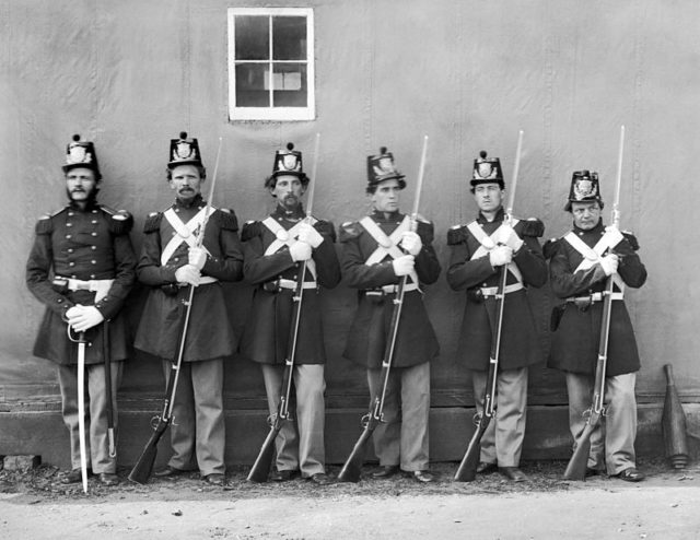 Five Marines with fixed bayonets, and their NCO with his sword at the Washington Navy Yard, 1864. source