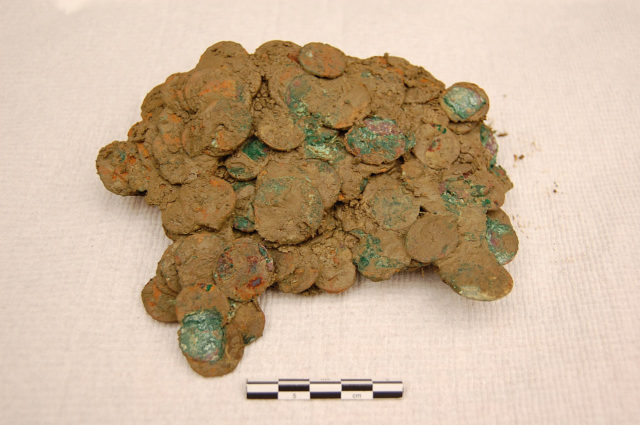 Aggregate of coins in sticky mud and corrosion from the Frome Hoard.Source