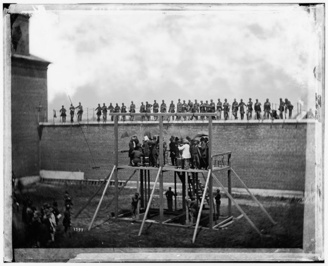 Conspirators Mary Surratt, Lewis Powell, David Herold and George Atzerodt are placed in nooses at the Washington Arsenal.