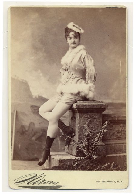Elvira Viola, sitting in fur fringe.