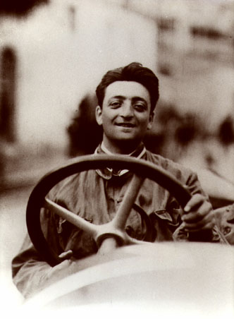Enzo Ferrari at the wheel of a racing car Source