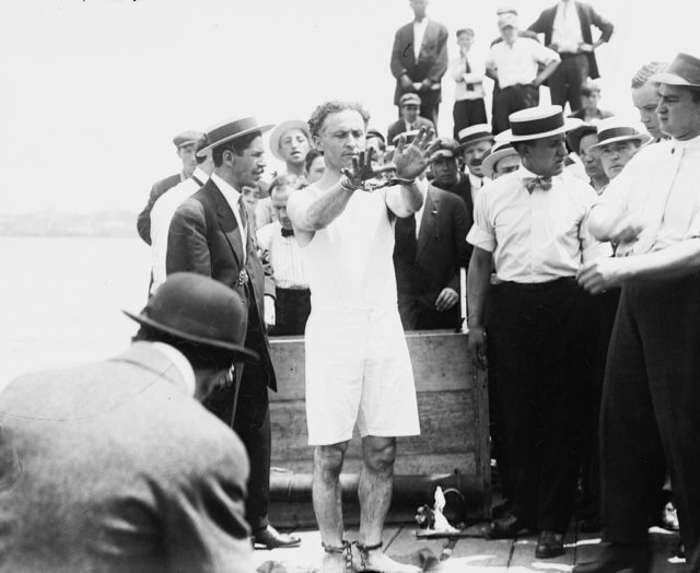 Houdini prepares to do the overboard box escape c. 1912 Source