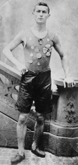 Not yet Houdini, Ehrich Weiss is shown exhibiting his competitive spirit and wearing medals he won as a member of the Pastime Athletic Club track team in New York c. 1890. Source