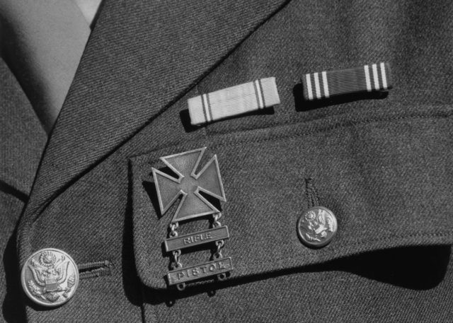 Service ribbons and qualification badge on the uniform of Corporal Jimmie Shohara.