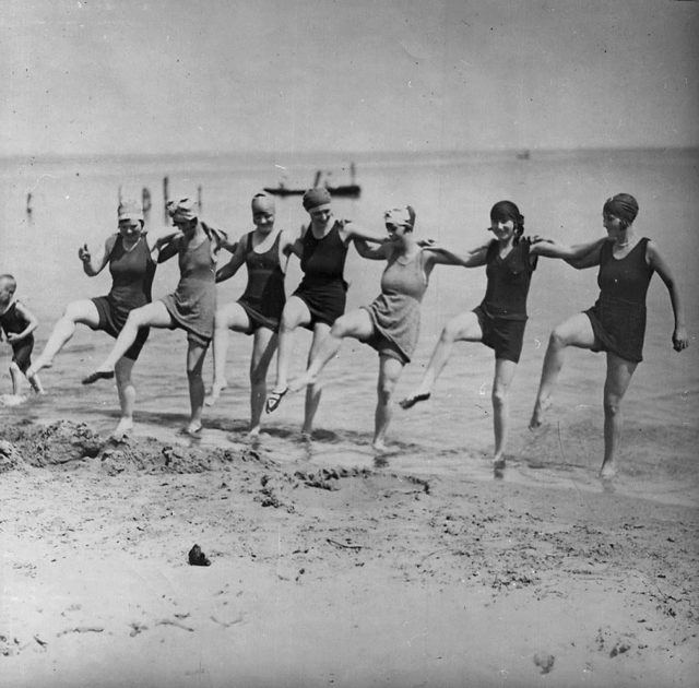 Women dancing on beach, Toronto, Canada. . source