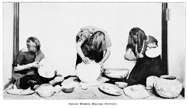 Zuni Indian women making pottery vases.