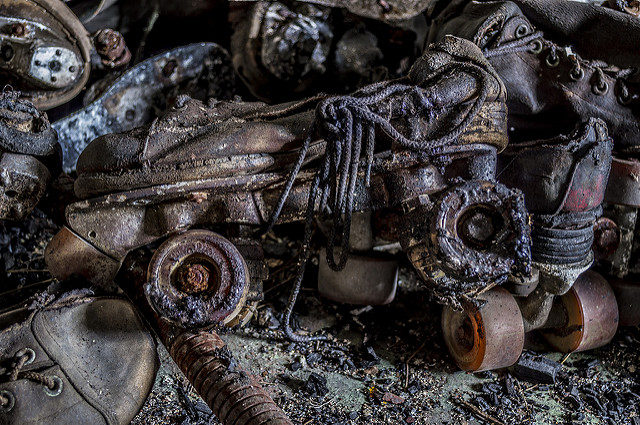 A big pile of burnt and melted roller skates sit in the burnt out projection room of the Skate Arena.