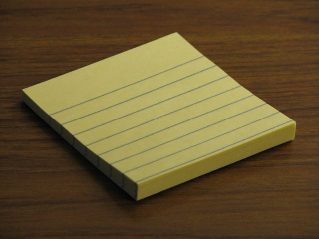 A small pad of Post-It notes. Source