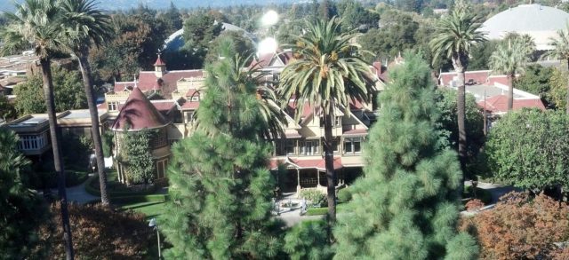 A view of the Winchester Mystery House from a highrise building to the south Source