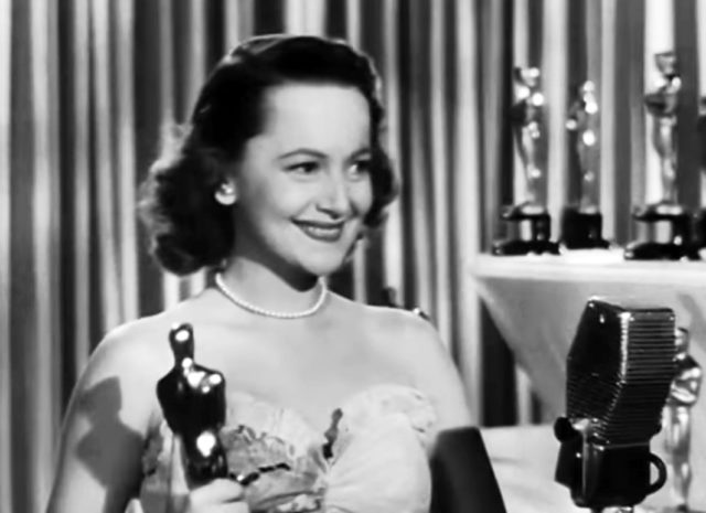 Accepting her first Academy Award for To Each His Own, March 13, 1947Source