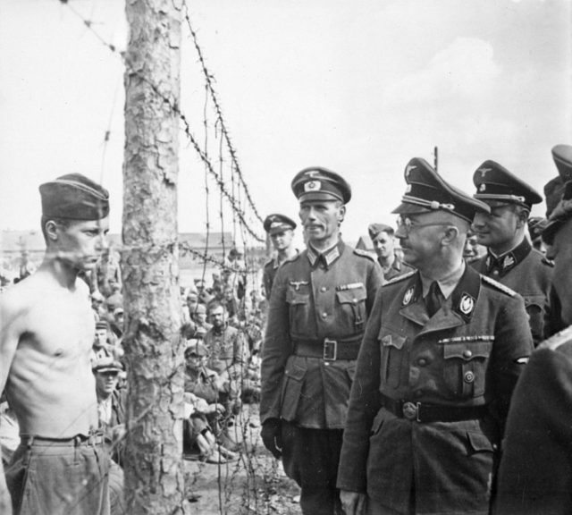 Himmler inspects a prisoner of war camp in Russia, circa 1941. Source