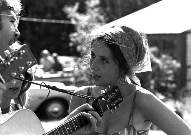 Singer Maria Muldaur in 1968, wearing a gypsy-style kerchief and hoop earrings.Source