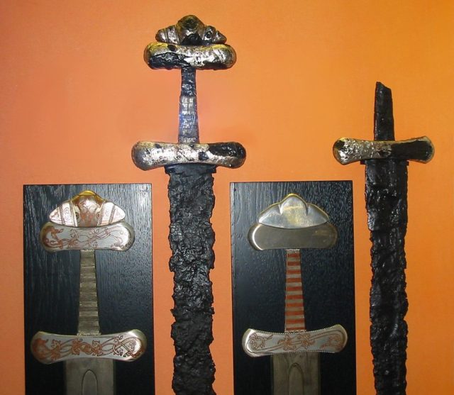 Two sword hilts on exhibit in Hedeby Museum. Source