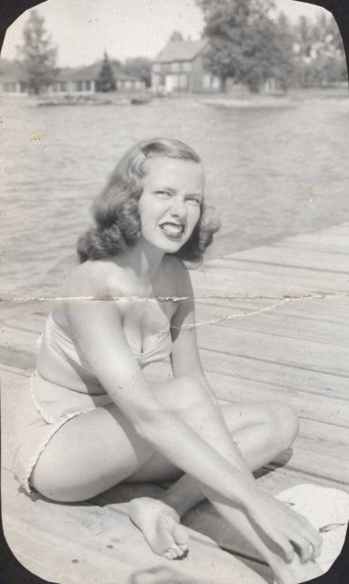 Young woman at lake in swimsuit, 1945.Source