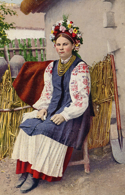 A lady wearing a Ukrainian vyshyvanka with a wreath 