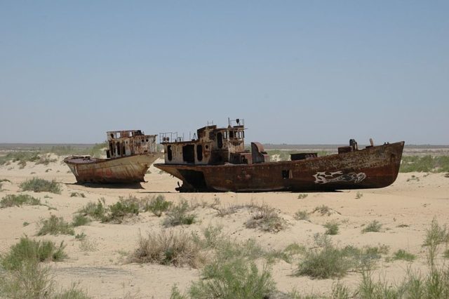 Abandoned ships stranded in the desert. Source