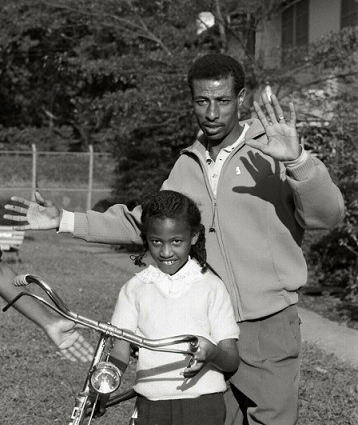 Abebe with son at the 1964 Olympics Source