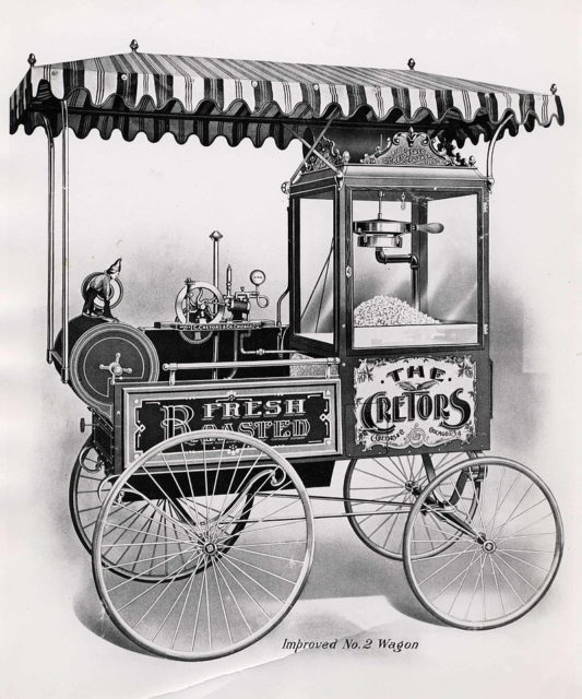 An early popcorn machine in a street cart, invented in the 1880s by Charles Cretors in Chicago.Source