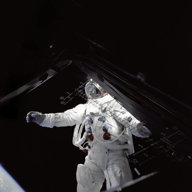 Astronaut Russell Schweickart, lunar module pilot, stands on the module's deck during his spacewalk on the fourth day of the Apollo 9 mission.