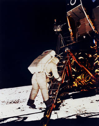Buzz Aldrin climbs down the Eagle's ladder to the surface. Click image to enlarge.