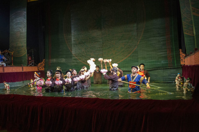Puppeteers out on stage for final act. Source