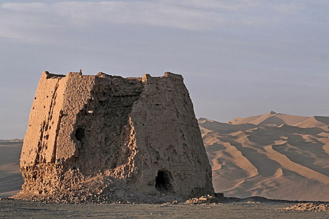 The ruins of a Han-dynasty watchtower made of rammed earth at Dunhuang, Gansu province, the eastern edge of the Silk Road. Photo credit