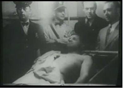 The body of Charles “Pretty Boy” Floyd is propped on a slab in the county morgue in East Liverpool, Ohio