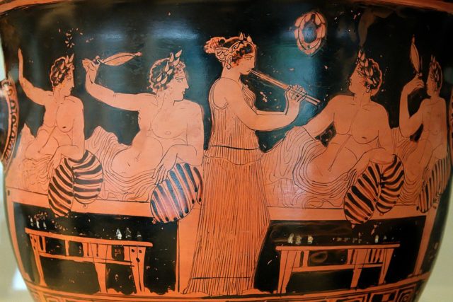 A female aulos-player entertains men at a symposium c. 420 BC Photo Credit