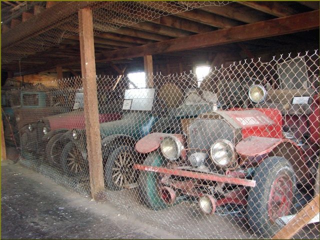 Just a few of the many antique vehicles gathering dust in the old Shaniko Livery Barn. By Don Graham Flickr CC BY-SA 2.0