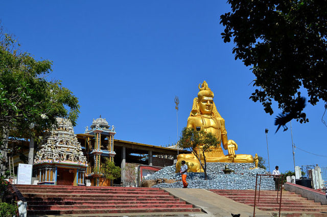 Golden statue of Shiva in front of partially restored Koneswaram temple where the inscriptional poem praising Raja Raja Chola I was found