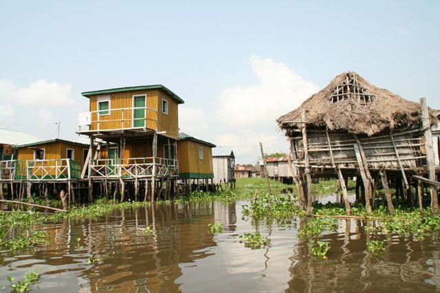 A bustling town of over 30,000 residents who live in bamboo huts built on stilts. Photo Credit