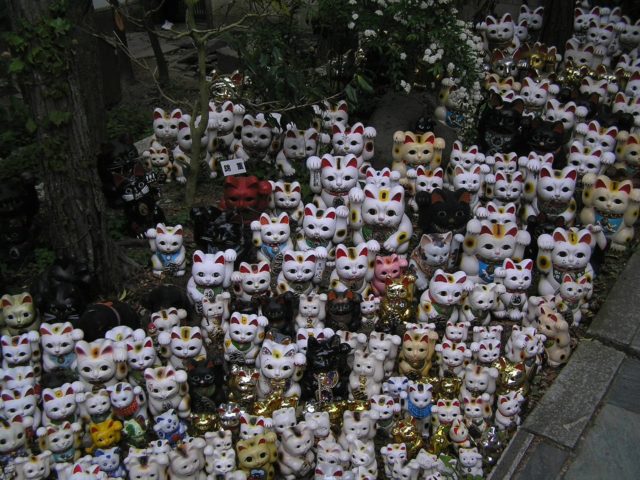a-large-number-of-maneki-neko-figurines-at-the-shrine-photo-credit