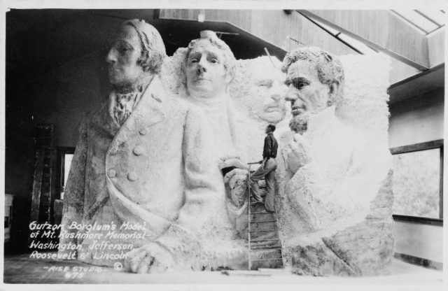 A model at the site depicting Mount Rushmore's intended final design